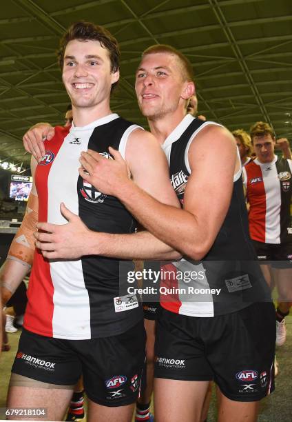 Blake Acres and Sebastian Ross of the Saints celebrate winning the round seven AFL match between the St Kilda Saints and the Greater Western Sydney...