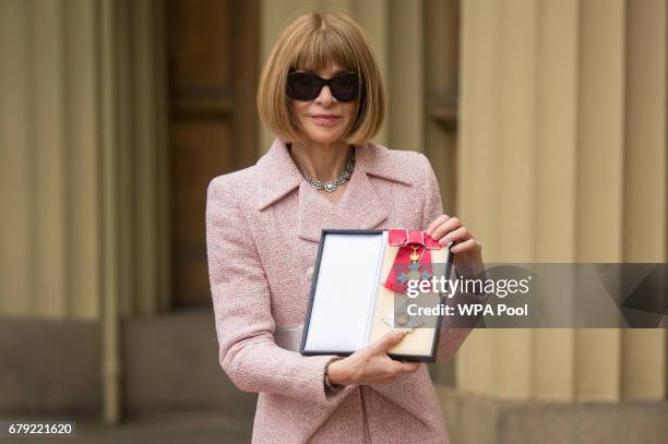 Editor-in-Chief, American Vogue and Artistic Director Dame Anna Wintour poses after receiving her Dame Commander from Queen Elizabeth II at an...