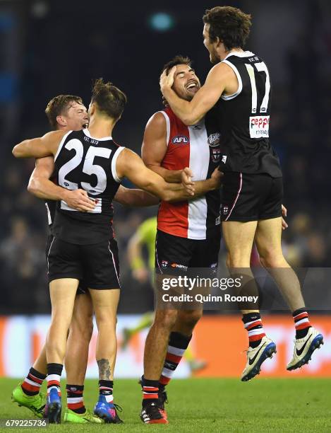 Jack Newnes, Koby Stevens, Billy Longer and Dylan Roberton of the Saints celebrate winning the round seven AFL match between the St Kilda Saints and...