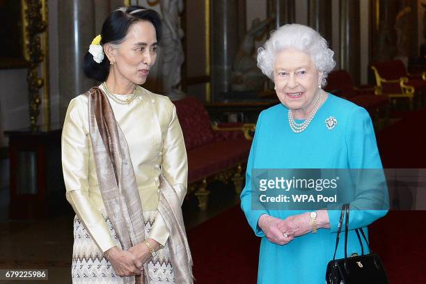 Queen Elizabeth II greets Burma's de facto leader Aung San Suu Kyi ahead of a private lunch at Buckingham Palace on May 5, 2017 in London, England.