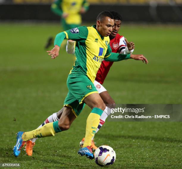 Norwich City's U21 Jacob Murphy is challenged by Arsenal's U21 GedionZelalem during their match at Carrow Road, Norwich.