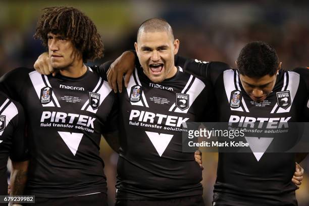 Kevin Proctor, Russell Packer and Jason Taumalolo of the Kiwis are seen after the singing of the national anthem during the ANZAC Test match between...