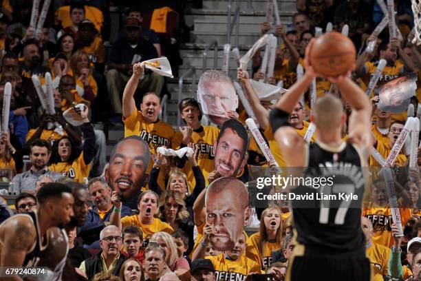 The Cleveland Cavaliers fans cheer while Jonas Valanciunas of the Toronto Raptors shoots a foul shot during Game Two of the Eastern Conference...