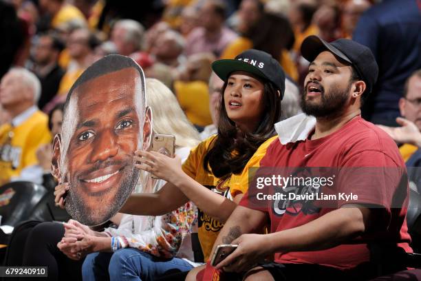 Cleveland Cavaliers fans hold signs during Game Two of the Eastern Conference Semifinals against the Toronto Raptors during the 2017 NBA Playoffs on...
