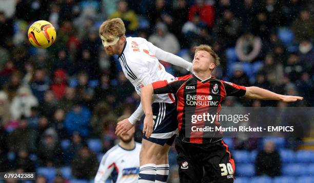 Bolton Wanderers Tim Ream battles for the ball with AFC Bournemouth's Matt Ritchie