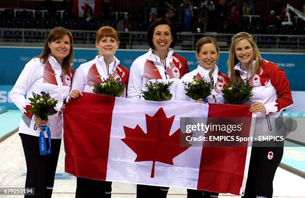 Canada's skip Jennifer Jones with her team as they celebrate winning Gold over Sweden