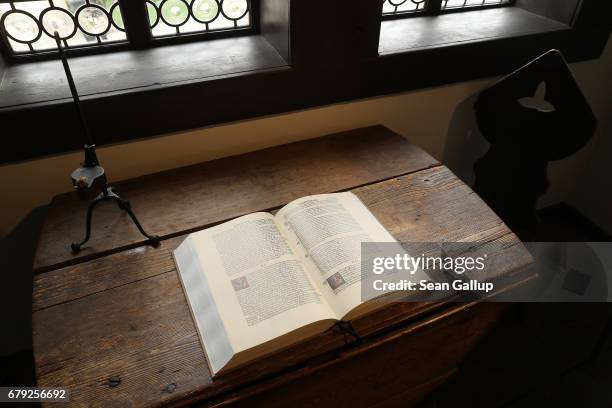 Modern reproduction of Martin Luther's translation into German of the Bible lies on a table at the Lutherhaus museum on May 5, 2017 in Eisenach,...