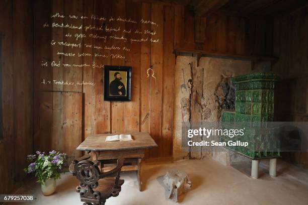 Text by German historian Heinrich von Treitschke as well as a portait painting of Martin Luther are displayed in the room where Luther translated the...