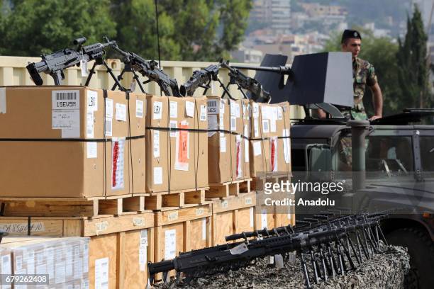 Lebanese soldier waits near heavy machine guns distributed by United States Army during the handover ceremony in Lebanon, Beirut on May 5, 2017.