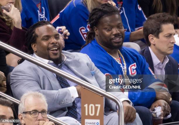 Damon Harrison and friend attend Ottawa Senators Vs. New York Rangers 2017 Playoffs Game 4 at Madison Square Garden on May 4, 2017 in New York City.
