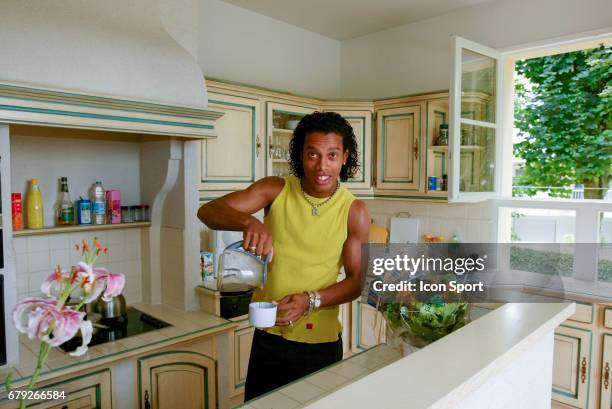 Ronaldinho in his kitchen during a photoshoot at home in Bougival near Paris, France on 30th July 2002