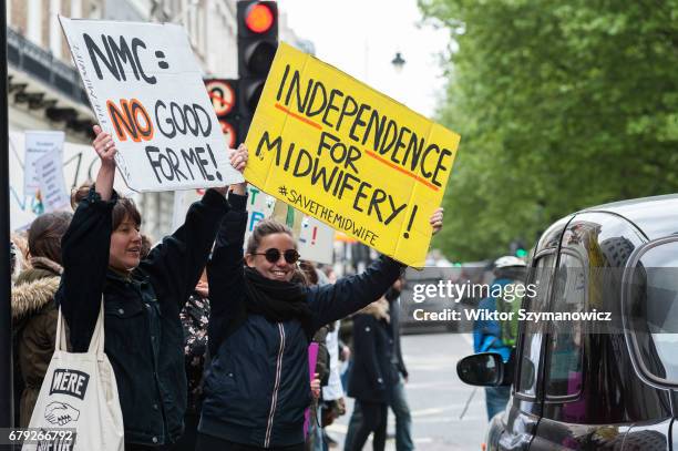 Midwives, nurses and parents gather outside the Nursing and Midwifery Council in London to protest against council's lack of protection and incorrect...