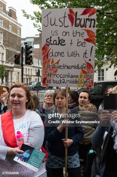 Midwives, nurses and parents gather outside the Nursing and Midwifery Council in London to protest against council's lack of protection and incorrect...