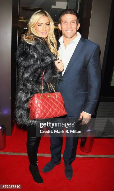 Chantelle Houghton and Alex Reid attend the launch of the Savile Row tailor Gary Anderson's new season collection on November 24, 2011 in London,...