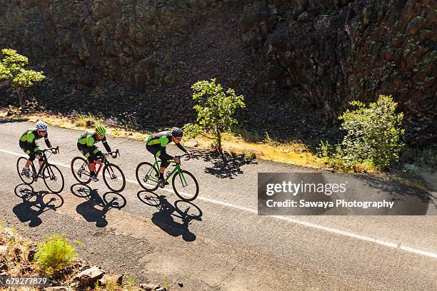 a team of cyclists on a scenic ride. - bicycle top view stock-fotos und bilder