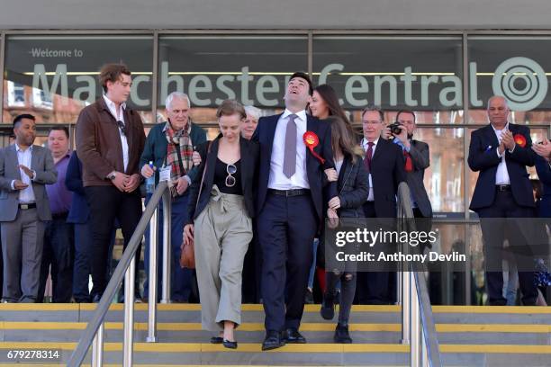 Labour's Andy Burnham celebrates winning the Greater Manchester mayoral election with wife Marie-France van Heel and daughter Annie at Manchester...