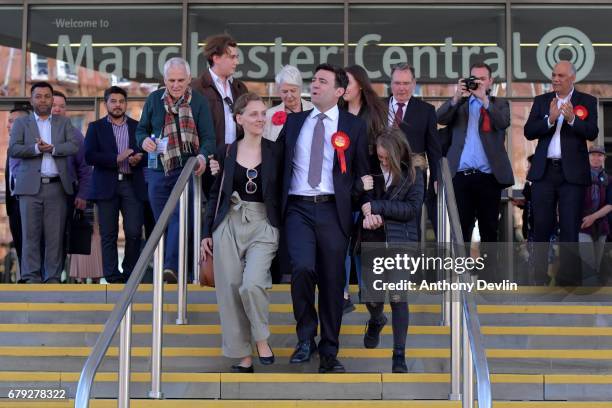 Labour's Andy Burnham celebrates winning the Greater Manchester mayoral election with wife Marie-France van Heel and daughter Annie at Manchester...
