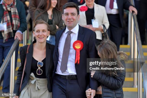 Labour's Andy Burnham celebrates winning the Greater Manchester mayoral election with wife Marie-France van Heel and daughter Annie at Manchester...