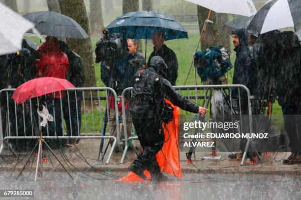 Media wait under the rain outside of the US Federal Courthouse in Brooklyn the exit of The wife of 'El Chapo', Emma Coronel Aispuro after a hearing...