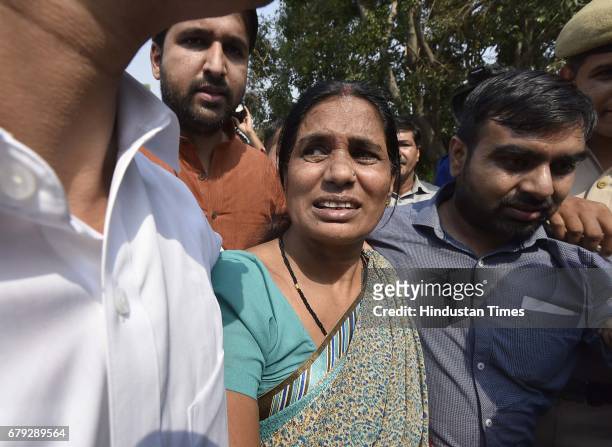 Mother of the victim coming out of the Supreme Court, after the court pronounced verdict on the appeals filed by four death row convicts against...