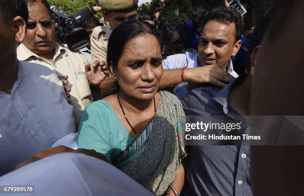 Mother of the victim coming out of the Supreme Court, after the court pronounced verdict on the appeals filed by four death row convicts against...