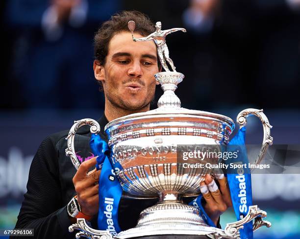 Rafael Nadal of Spain celebrates with the trophy after winning his match and become Champion of the Barcelona Open Banc Sabadell against Dominic...