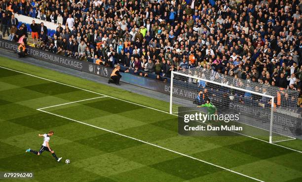 Harry Kane of Tottenham Hotspur scores his sides second goal past Petr Cech of Arsenal from the penalty spot during the Premier League match between...
