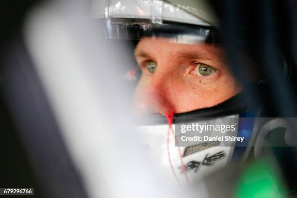 Blake Koch, driver of the LeafFilter Gutter Protection Chevrolet, sits in his car during practice for the NASCAR XFINITY Series Sparks Energy 300 at...