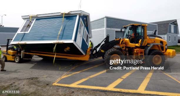 Plans go awry as the delivery of a donated building nearly topples on its way from the construction technology program at Southern Maine Community...