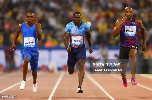 Akani Simbine of South Africa, Justin Gatlin of the United States, Asafa Powell of Jamaica compete in the Men's 100 metres during the Doha - IAAF...