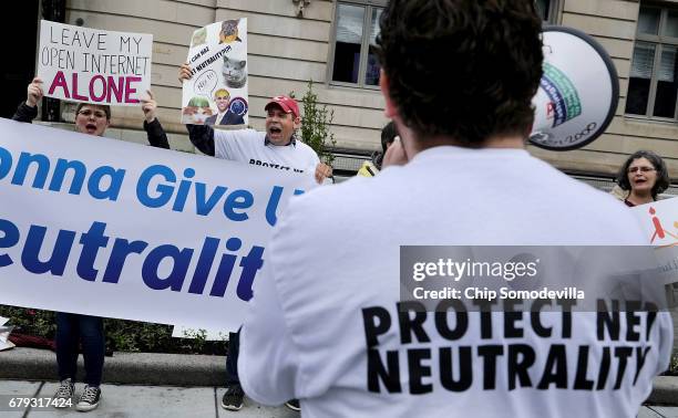 Proponents of net neutrality protest against Federal Communication Commission Chairman Ajit Pai outside the American Enterprise Institute before his...