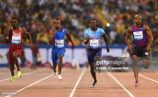 Femi Ogunode of Qatar, Akani Simbine of South Africa, Justin Gatlin of the United States, Asafa Powell of Jamaica compete in the Men's 100 metres...