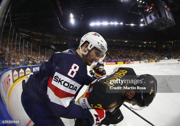 Jacob Trouba of USA challenges Patrick Reimer of Germany during the 2017 IIHF Ice Hockey World Championship game between USA and Germany at Lanxess...