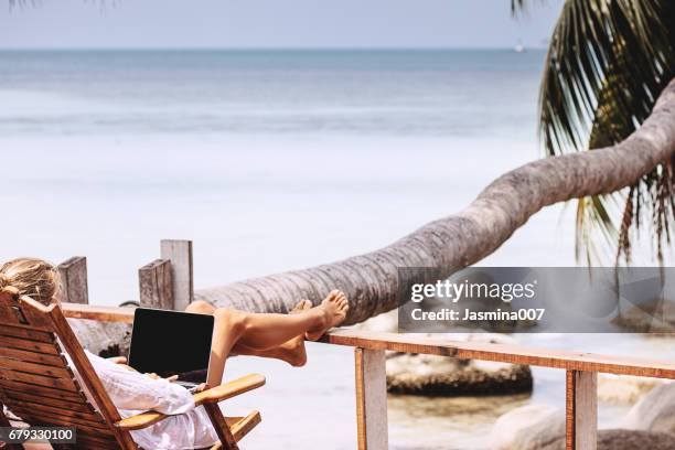 young woman working on the beach - time off work stock pictures, royalty-free photos & images