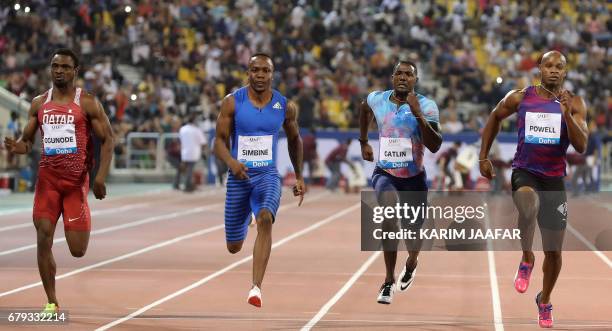 Qartar's Femi Ogunode South Africa's Akani Simbine, US' Justin Gatlin and Jamaica's Asafa Powell compete in the men's 100 metres during the Diamond...