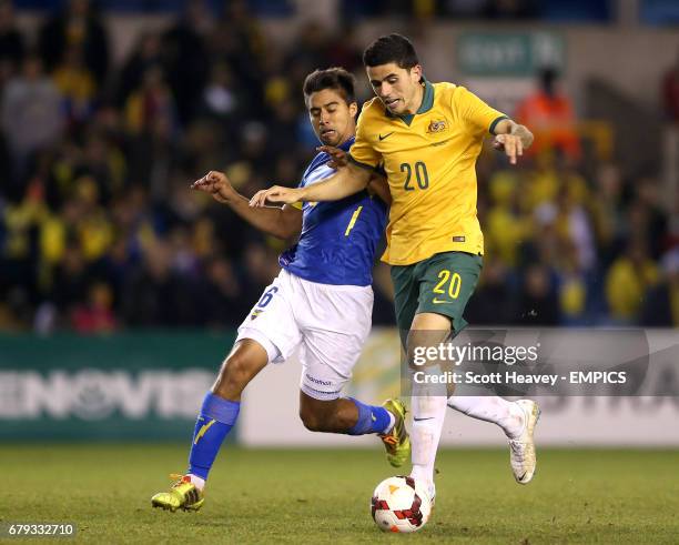 Ecuador's Christian Noboa and Australia's Tomas Rogic battle for the ball