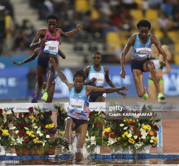 Athletes compete in the women's 3000 metres steeplechase during the Diamond League athletics competition at the Suhaim bin Hamad Stadium in Doha, on...