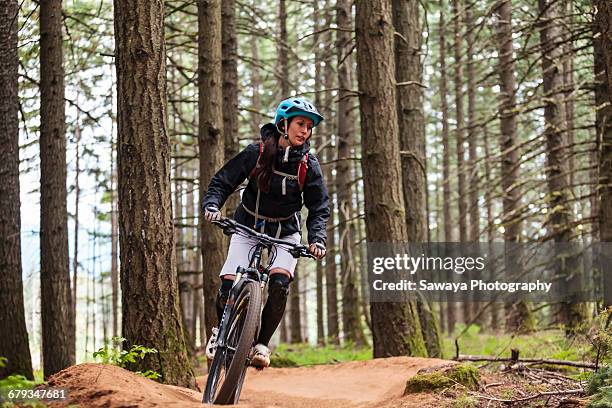 a mountain biker enjoying oregon single track. - sawaya stock pictures, royalty-free photos & images