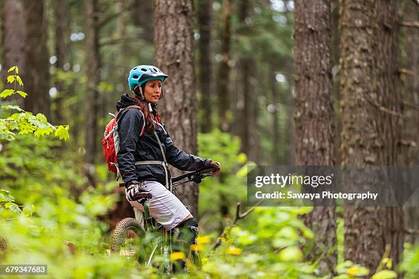 a mountain biker enjoying oregon single track. - sawaya stock pictures, royalty-free photos & images