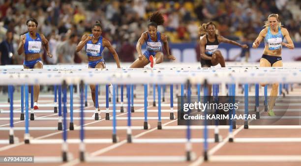 Athletes compete in the women's 100 metres hurdles during the Diamond League athletics competition at the Suhaim bin Hamad Stadium in Doha, on May 5,...