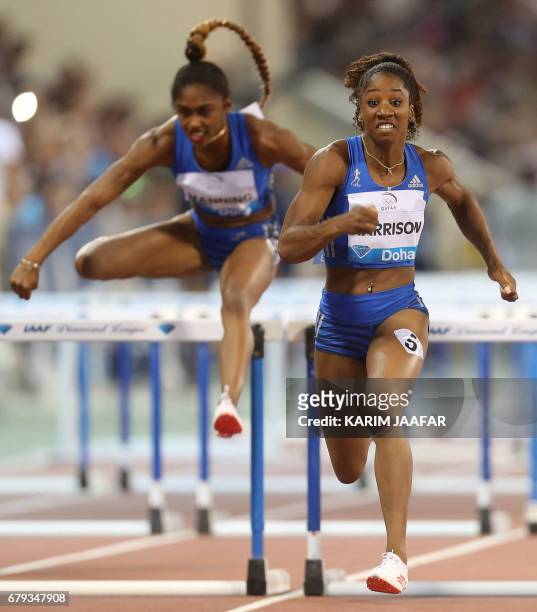 Christina Manning and Kendra Harrison compete in the women's 100 metres hurdles during the Diamond League athletics competition at the Suhaim bin...