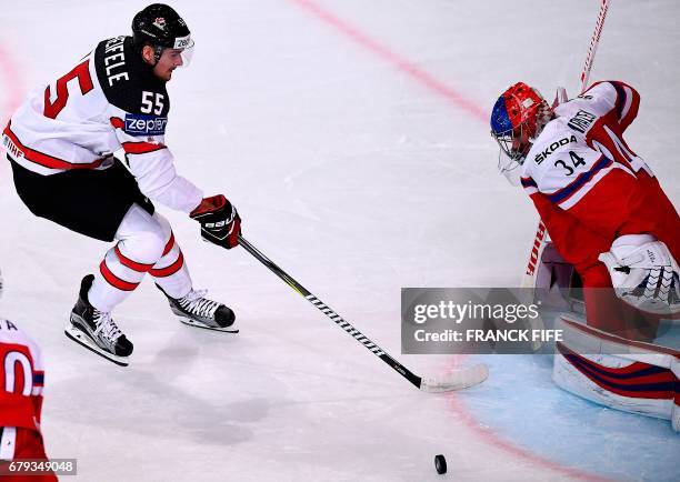 Czech Republic's goalkeeper Petr Mrazek prepapres to block a shot by Canada's forward Mark Scheifele during the IIHF Men's World Championship group B...