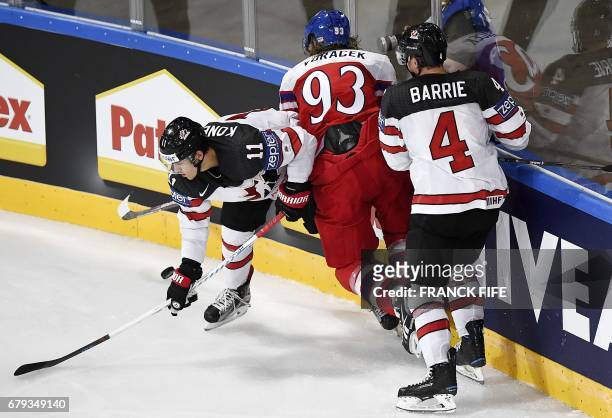 Canada's forward Travis Konecny and defender Tyson Barrie challenge Czech Republic's forward Jakub Voracek during the IIHF Men's World Championship...