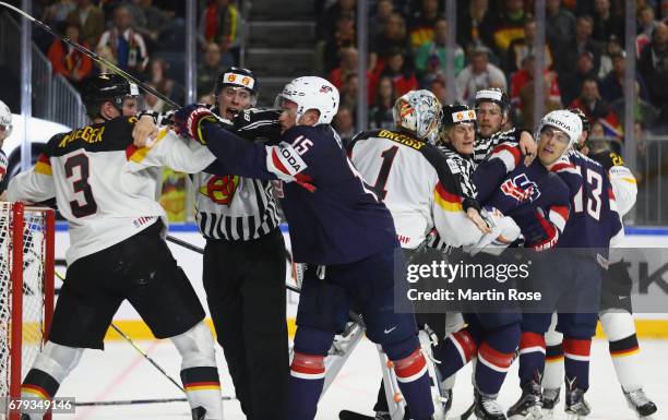 Jack Eichel of USA fights with Justin Krueger of Germany during the 2017 IIHF Ice Hockey World Championship game between USA and Germany at Lanxess...