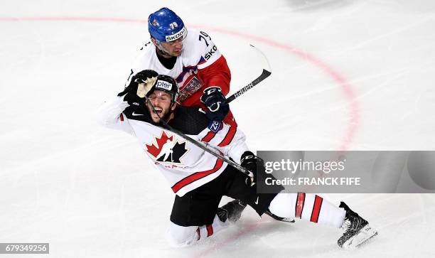 Czech Republic's forward Tomas Zohorna challenges Canada's defender Jason Demers during the IIHF Men's World Championship group B ice hockey match...