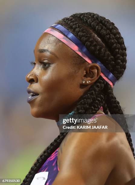 Jamaica's Elaine Thompson reacts after winning the women's 200 metres during the Diamond League athletics competition at the Suhaim bin Hamad Stadium...