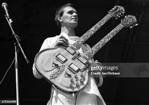 John McLaughlin performing on stage with Mahavishnu Orchestra at Knebworth Festival, Knebworth House, Hertfordshire, 20 July 1974.