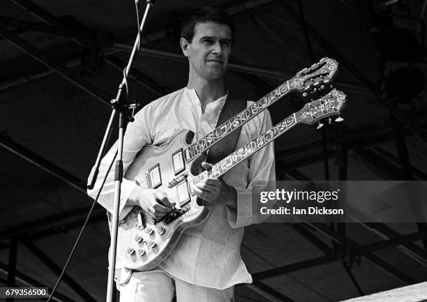 John McLaughlin performing on stage with Mahavishnu Orchestra at Knebworth Festival, Knebworth House, Hertfordshire, 20 July 1974.