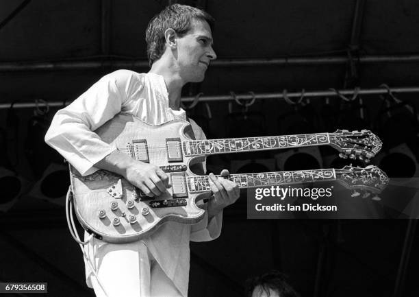 John McLaughlin performing on stage with Mahavishnu Orchestra at Knebworth Festival, Knebworth House, Hertfordshire, 20 July 1974.