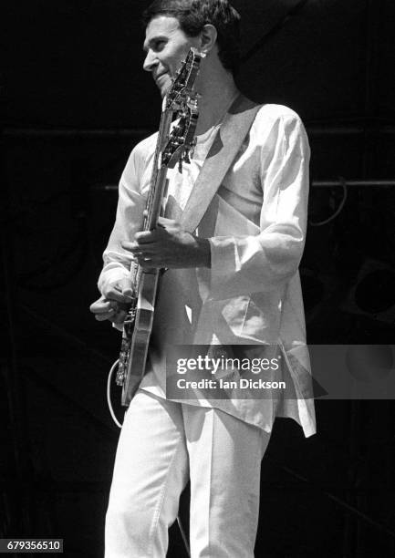 John McLaughlin performing on stage with Mahavishnu Orchestra at Knebworth Festival, Knebworth House, Hertfordshire, 20 July 1974.